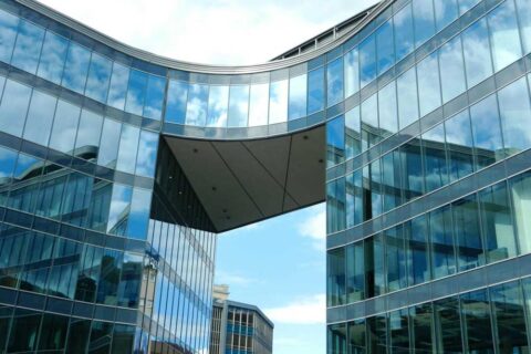 A photo of glass buildings during daylight.